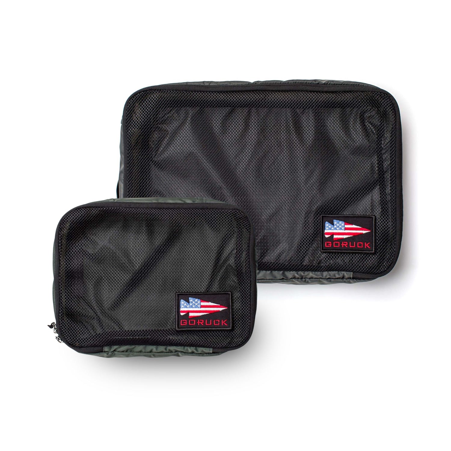 The Packing Cube Bundle includes two black ultra-light nylon cubes with GORUCK logo patches and American flag designs for sleek travel organization, displayed on a white background.