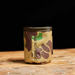 GORUCK camo ruck accessory pouch on wooden surface, rugged outdoor gear