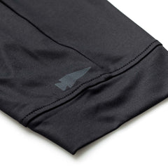 Close-up of the Women’s Training Performance Joggers shows black performance fabric, visible stitching, and a subtle arrow-shaped logo near the cuff.