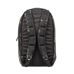 The Bullet Ruck Classic - Ballistic Nylon Cordura is shown from the back in black camouflage, featuring padded shoulder straps and metal loops.