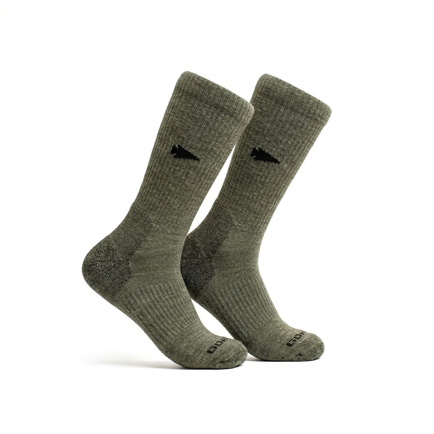 A pair of Merino Compression Socks in olive green, featuring a black arrow logo on each side, displayed on a white background.