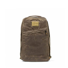 GORUCK dark oak rugged backpack with front zipper pocket and top handle against white background