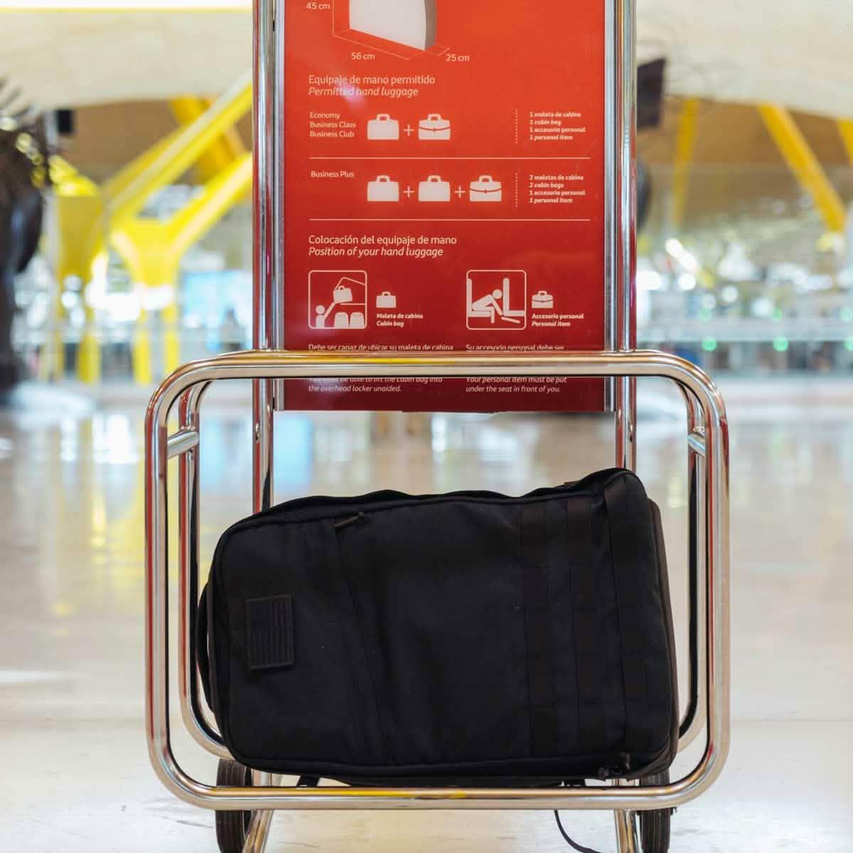 GORUCK carry-on compliant black rucksack shown fitting in airport luggage sizer