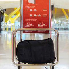 GORUCK carry-on compliant black rucksack shown fitting in airport luggage sizer