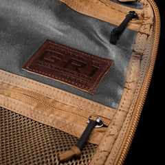 Closeup of GORUCK GR1 Heritage backpack interior label, mesh pocket, and zippers