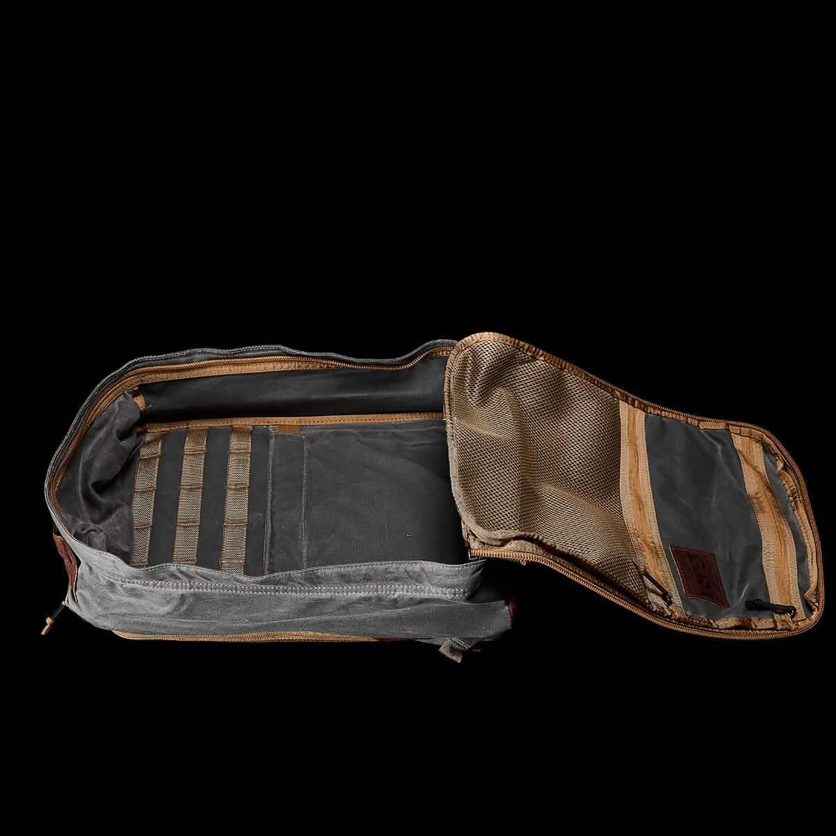 Open GORUCK rucksack showing spacious main compartment and mesh pocket, black background