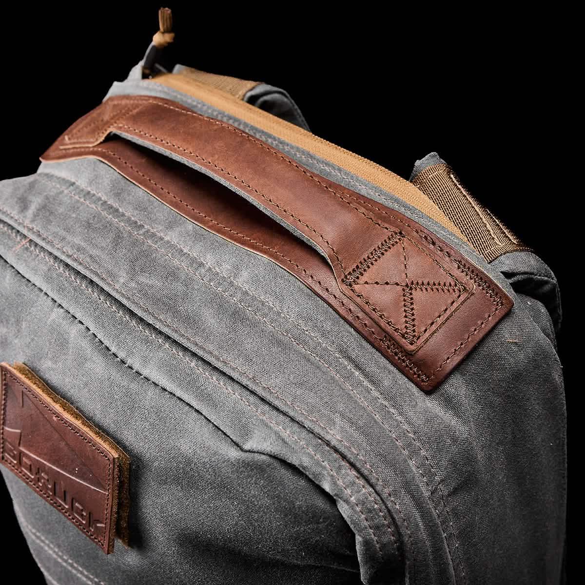 GORUCK slate gray rucksack with brown leather handle, rugged waxed canvas detail