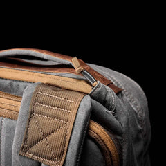 GORUCK heritage slate backpack corner showing rugged strap, zipper, and handle details
