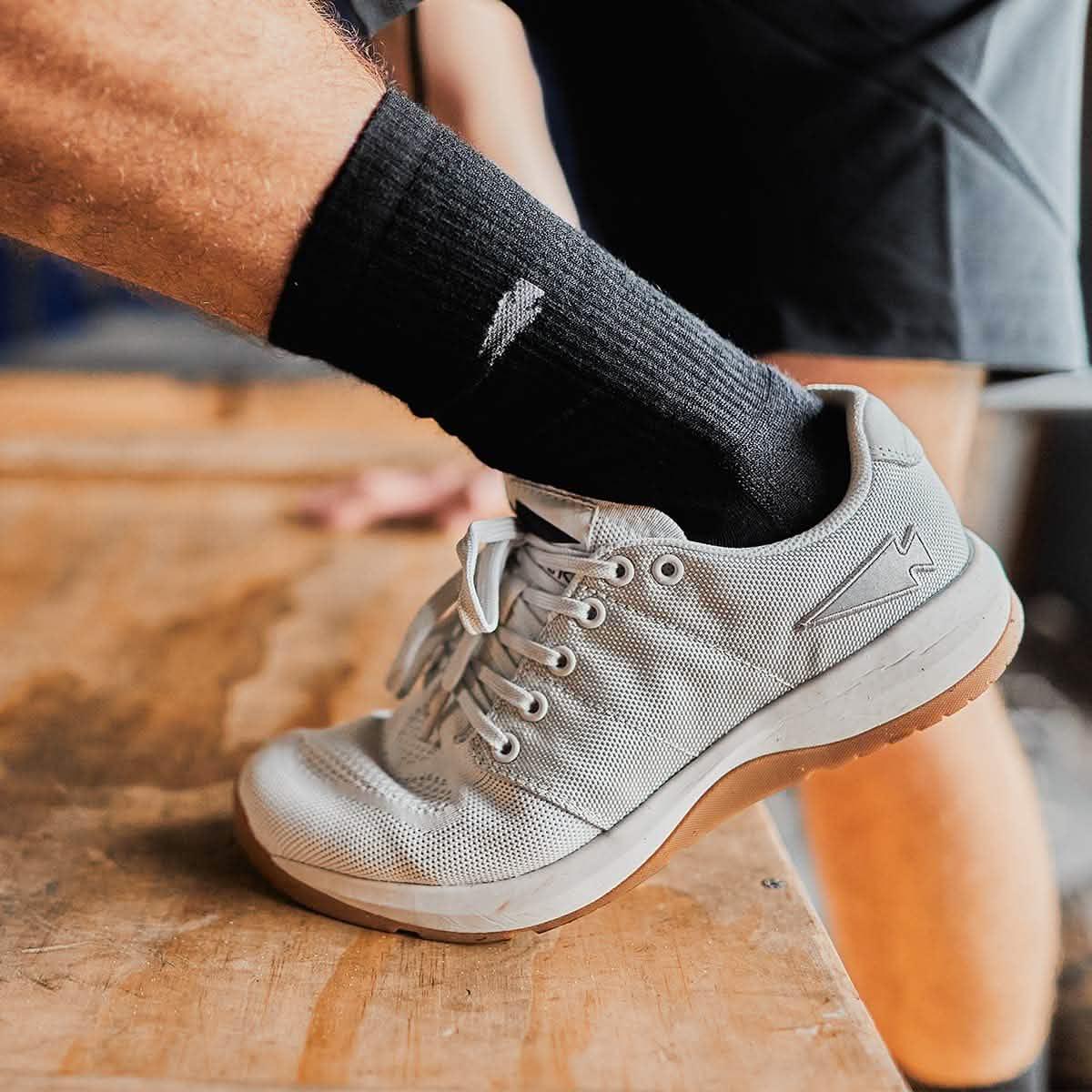 GORUCK Lunar Rock rucking shoe on foot stepping onto a wooden box, athletic gear focus
