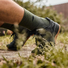 GORUCK Merino Ranger in black, outdoor rucking shoes with green socks on dirt trail