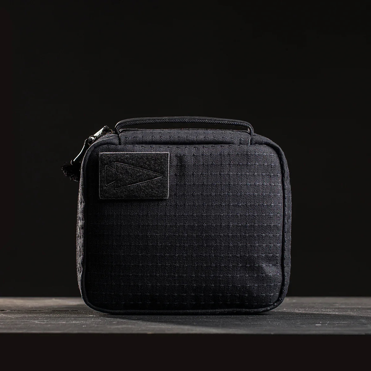 GORUCK black tactical rucking pouch with arrowhead patch on dark background