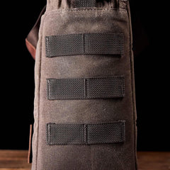 Close-up of GORUCK rugged brown backpack side MOLLE webbing for rucking gear attachment