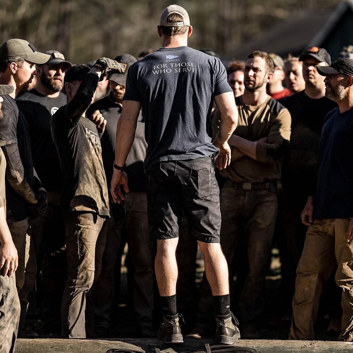 GORUCK outdoor rucking event with group of people in rugged gear, team training focus