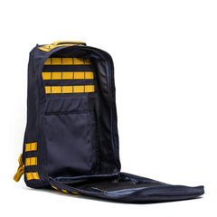 A GR1 rucksack in navy with yellow accents, shown unzipped to display Special Forces-grade yellow interior straps and pockets, set against a white background.