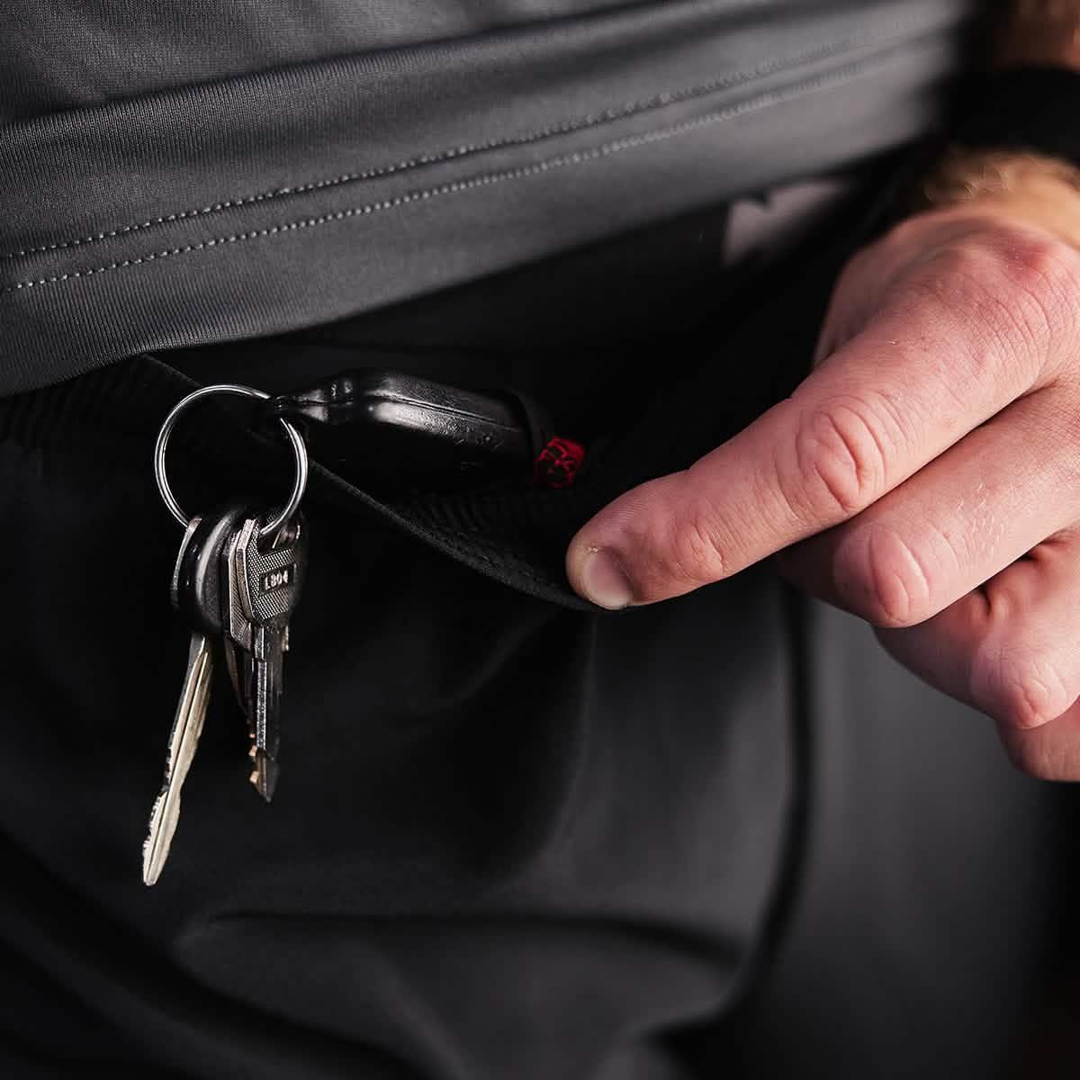 Close-up of GORUCK pants pocket with key ring secured inside, emphasizing rugged utility gear.