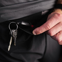 Close-up of GORUCK pants pocket with key ring secured inside, emphasizing rugged utility gear.