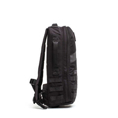 The Rucker 5.0, shown in side view against a white background, features padded straps and webbing details for comfortable rucking.
