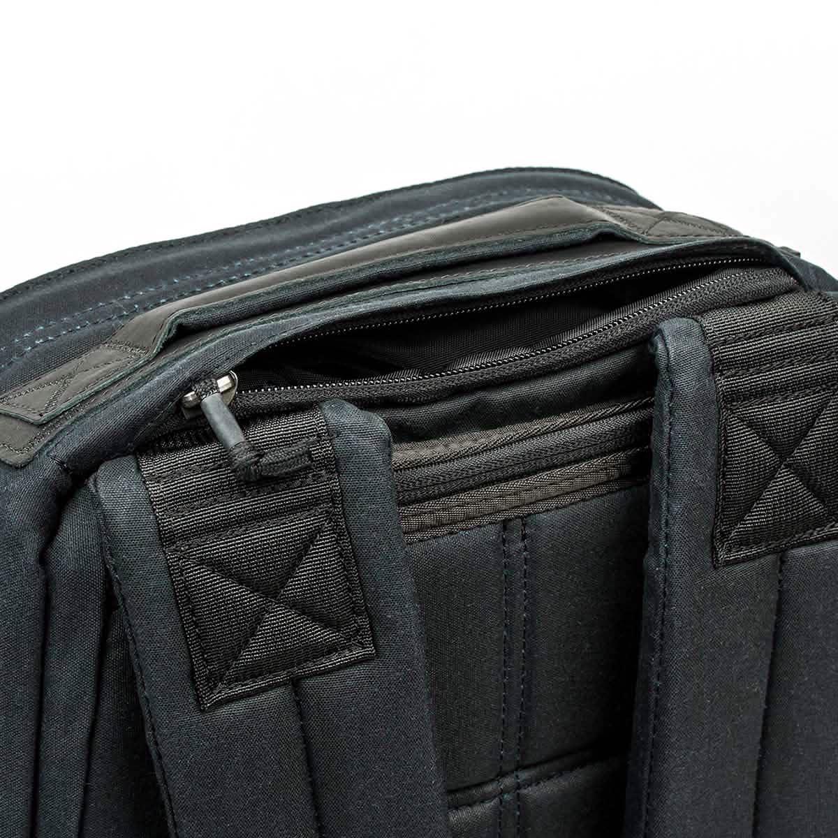 GORUCK tough black rucking backpack close-up showing shoulder straps and top zipper pocket