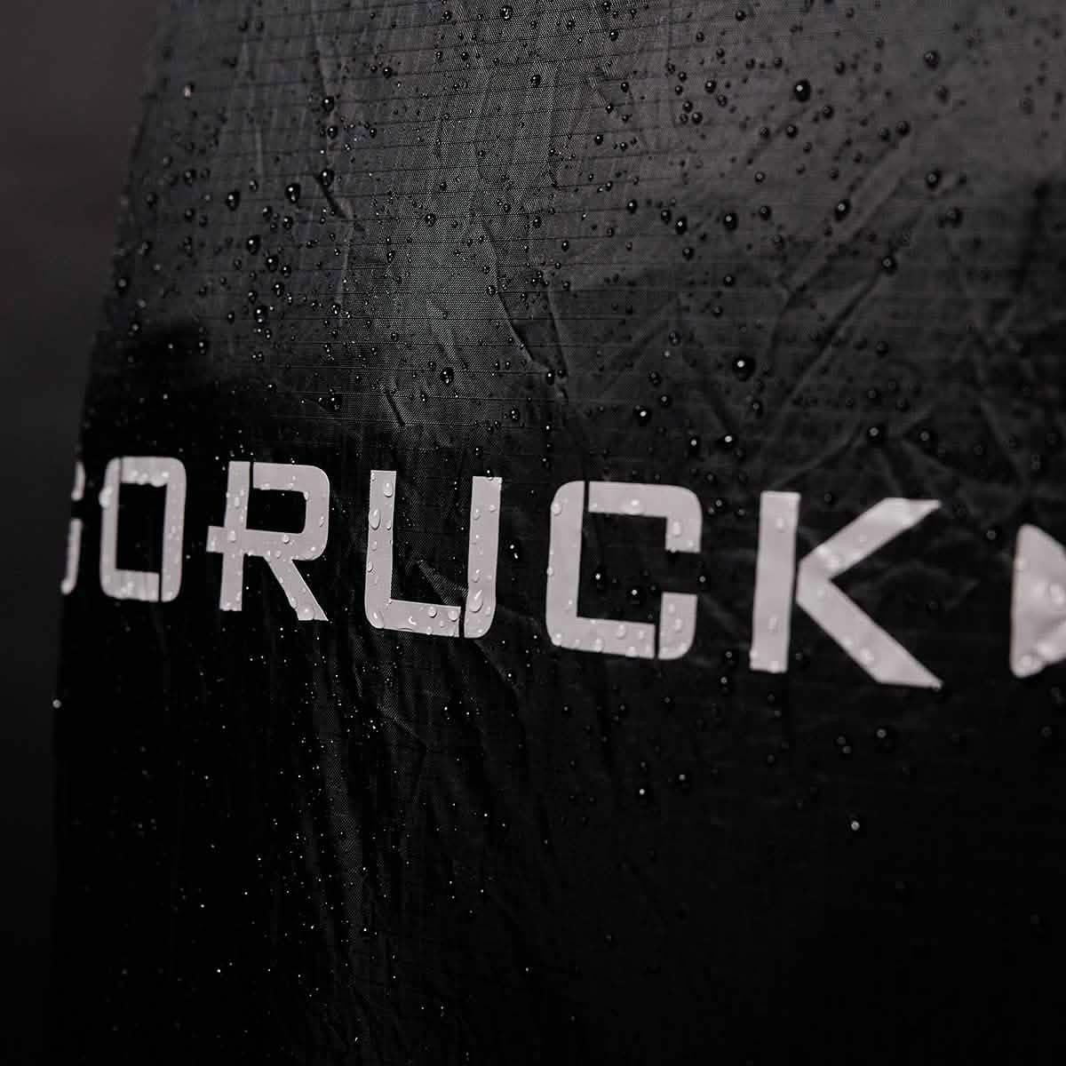 GORUCK black rucking gear with water droplets, rugged water-resistant fabric