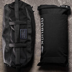 GORUCK 40LB sandbag and filler bag on concrete, durable black rucking gear