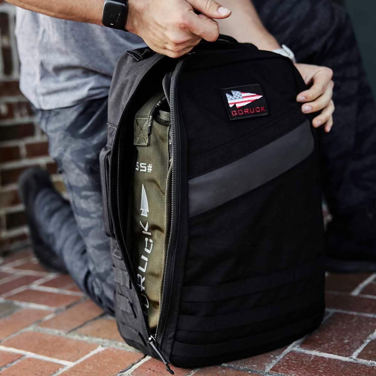 GORUCK rucksack with weight plate, black tactical backpack for rucking fitness gear