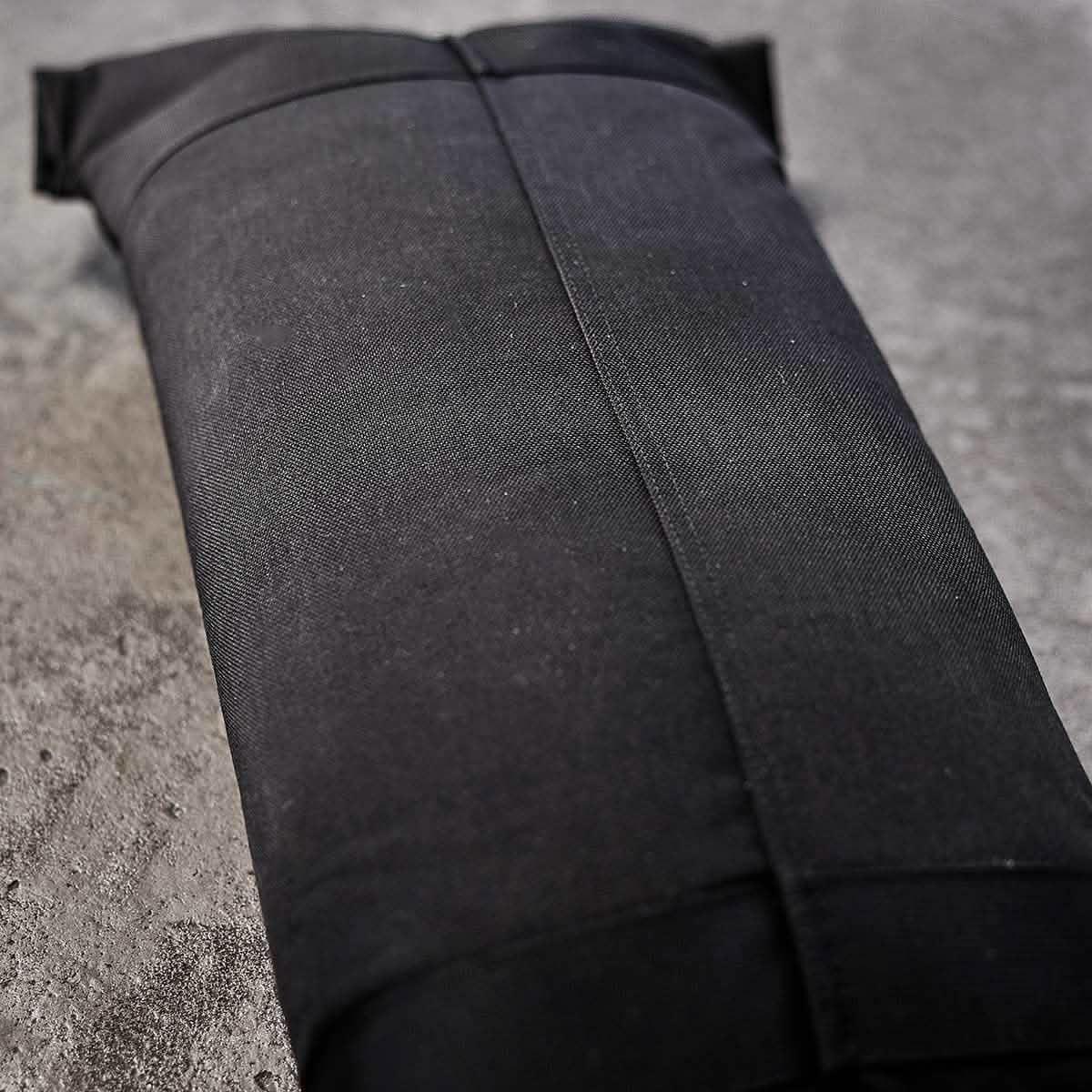GORUCK black ruck sandbag filler bag on concrete surface, durable fitness gear