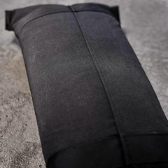 GORUCK black ruck sandbag filler bag on concrete surface, durable fitness gear