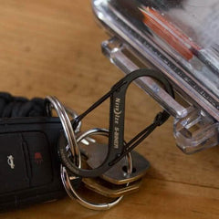 Nite Ize S-Biner keychain with keys and car fob on wood surface, GORUCK gear accessory