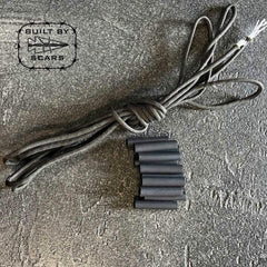 GORUCK paracord and heat shrink tubing kit on textured gray surface, Built by Scars logo