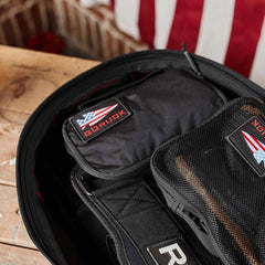 GORUCK Shadow Pocket M inside open rucksack with American flag patch and rugged packing gear