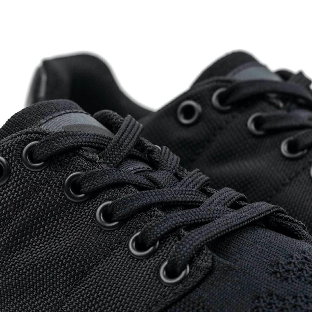 Close-up of GORUCK black reflective rucking shoes with durable laces and eyelets