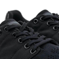 Close-up of GORUCK black reflective rucking shoes with durable laces and eyelets