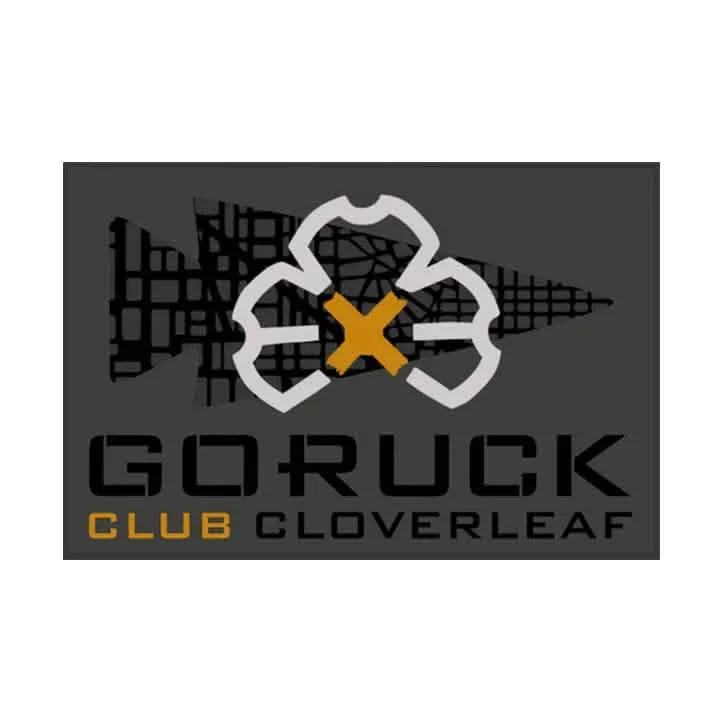 GORUCK Club Cloverleaf patch logo with gold X on dark background, rucking gear branding