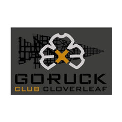 GORUCK Club Cloverleaf patch logo with gold X on dark background, rucking gear branding