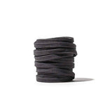 Coiled grey GORUCK boot laces on white background, durable rucking footwear accessory