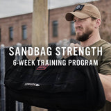 Man lifting GORUCK sandbag outdoors, sandbag strength 6-week training program promo