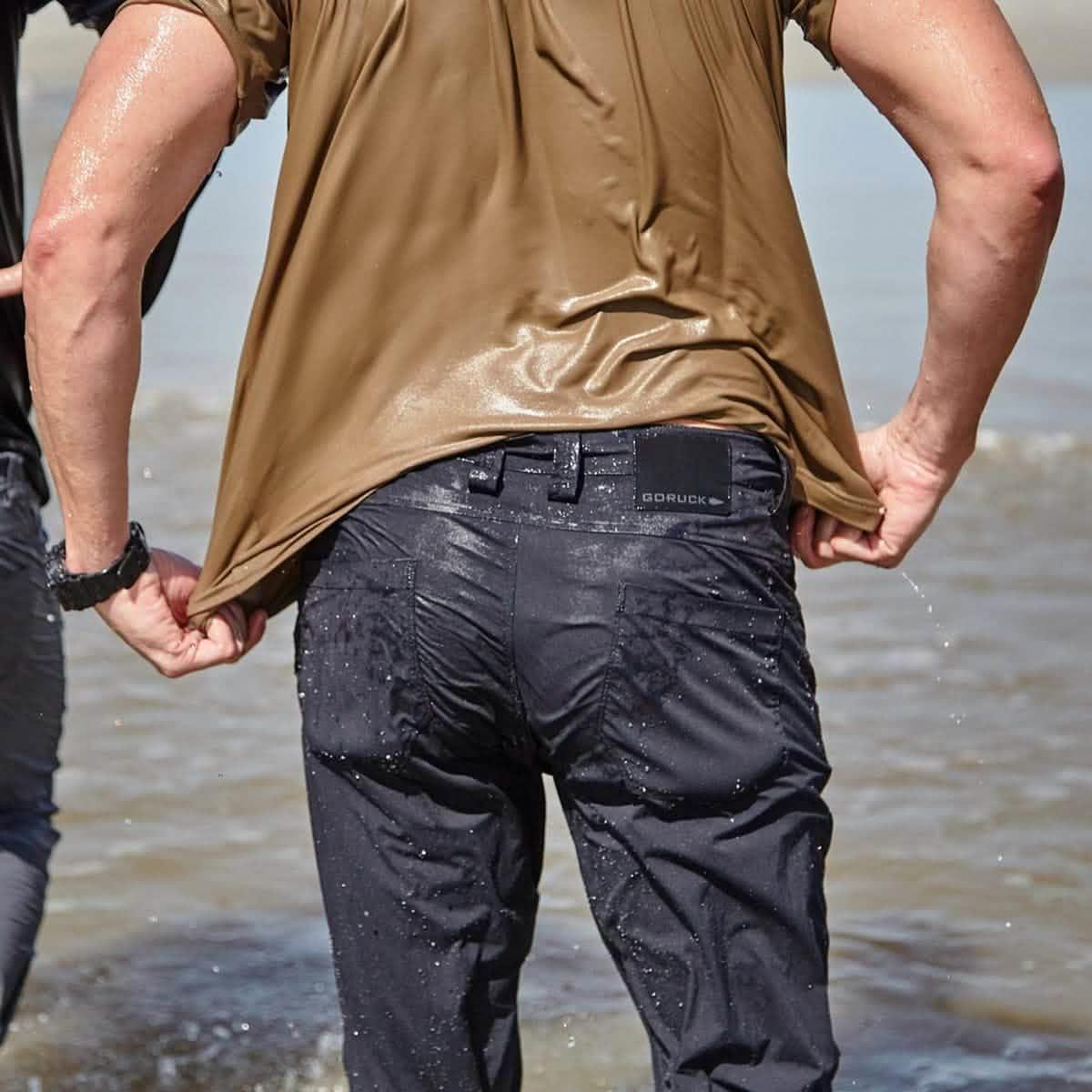 GORUCK Simple Pants Black Water, wet outdoor performance pants in water, back view