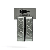 GORUCK reflective gear straps with diamond pattern on branded packaging, rucking accessory